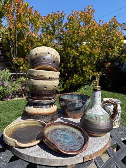 Handmade ceramic spoon rest, multiple pieces espresso oat glaze and copper deep sea blue handpainted glazes, wheel-thrown stoneware kitchen decor and art for your countertop, dishwasher safe, full shot of multiple pieces for your kitchen - Ceramics By Cou