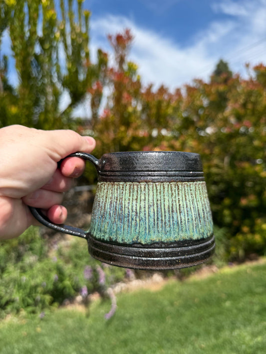 Handmade carved stoneware mug, A-shape coffee cup with stable base and comfortable handle, made with black clay and sparkly black glaze - Ceramics By Court